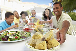 Family Eating An Al Fresco Meal