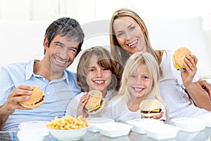 Family eating hamburgers photo