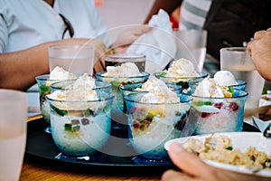 Family eating with ordered seven servings of the popular and favorite Filipino cold dessert Halo-halo also spelled haluhalo