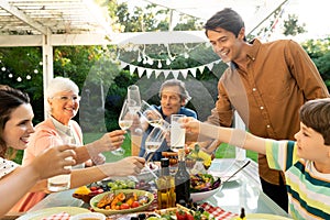 Family eating outside together in summer