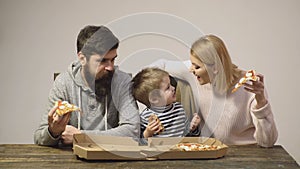 Family eating pizza. Happy parent kid with favorite food. Happy together leisure, hungry man woman eat pizza.