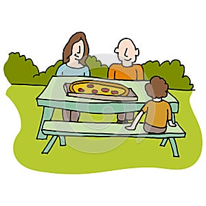 Family eating pizza at picnic table