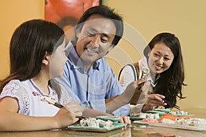 Family Eating Sushi Together