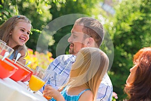 Family eating together outdoors