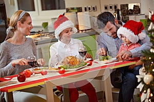 Family eating traditional Christmas dinner