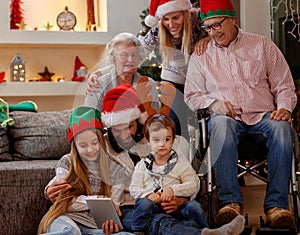 Family and elderly grandparents celebrating Christmas