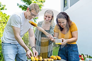 Family enjoy backyard barbecues party. People hanging out at home party. Family having a barbecue party at home. Family Cooking gr