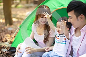 Family Enjoy Camping Holiday In Countryside