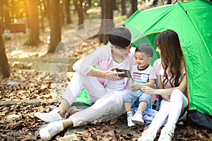 Family Enjoy Camping Holiday In Countryside