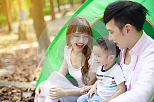 Family Enjoy Camping Holiday In Countryside