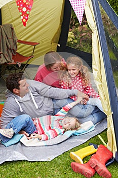 Family Enjoying Camping Holiday On Campsite