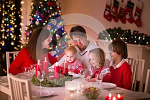 Family enjoying Christmas dinner at home