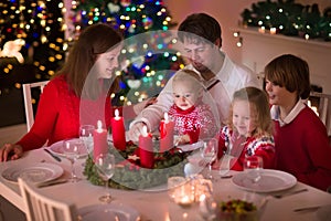 Family enjoying Christmas dinner at home