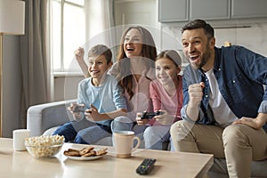 Family enjoying gaming time with laughter at home