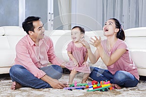 Family enjoying leisure time in the living room