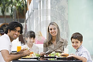 Family enjoying lunch at cafe