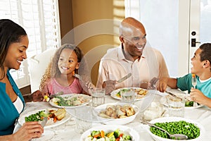 Family Enjoying Meal At Home