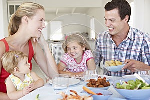 Family Enjoying Meal Together At Home