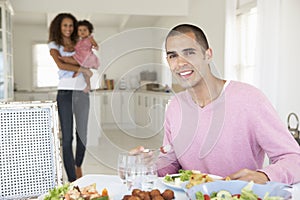 Family Enjoying Meal Together At Home