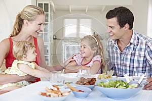 Family Enjoying Meal Together At Home