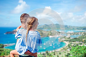 Family enjoying the view of picturesque English Harbour at Antigua in caribbean sea