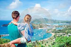 Family enjoying the view of picturesque English Harbour at Antigua in caribbean sea