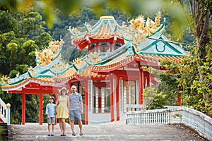 Family enjoying views of beautiful Chinese Temple on Koh Phangan island, Thailand