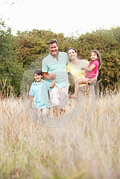 Family Enjoying Walk In Park