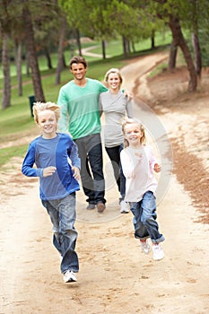 Family enjoying walk in park