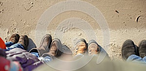 Family enjoying winter together, kids with parents walking on the beach, outdoors lifestyle