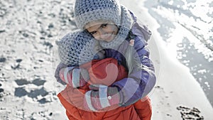 Family enjoying winter together, kids walking on the beach in winter, outdoors lifestyle