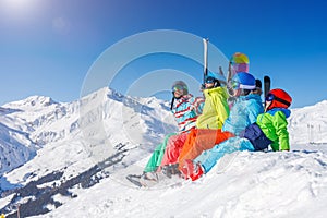 Family enjoying winter vacations in mountains . Ski, Sun, Snow and fun.