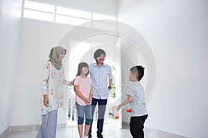 Family entering new house to buy