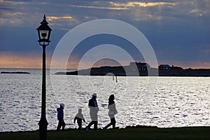 Family evening walk by the waterfront of Varberg Sweden