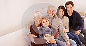 Family is everything. A cropped portrait of a happy multi-generation family sitting together on a sofa.