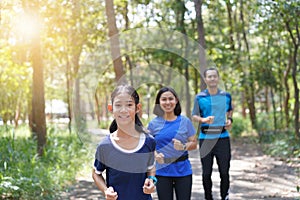 Family exercising and jogging together at the park