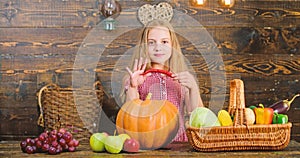 Family farm festival concept. Farm themed games and activities for kids. Girl kid at farm market with fall harvest