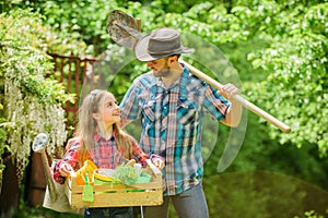 Family farm. summer farm. spring village country. ecology. Gardening tools. little girl and happy man dad. earth day