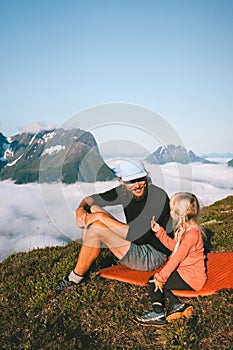 Family father and child hiking in mountains together travel active vacations parent and kid adventure tour