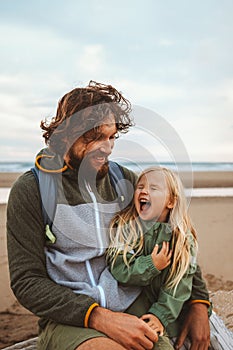 Family father with child outdoor dad with daughter happy laughing face vacations lifestyle together