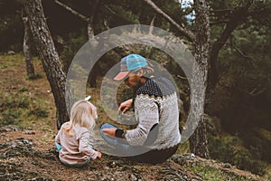 Family father and daughter child walking in forest