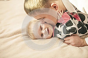 Family, father and daughter together at home cuddling beautiful