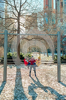 Family of father and kids in Central Park have fun on american vacation in New York