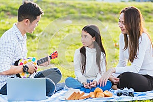 Family father, mother and children having fun and enjoying outdoor together