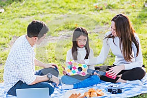 Family father, mother and children having fun and enjoying outdoor together