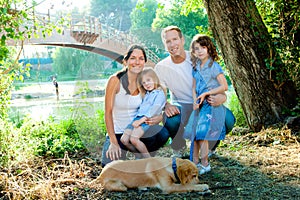 Family father mother kids and dog outdoor