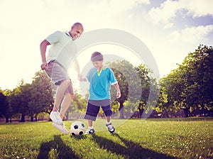 Family Father Son Playing Football Summer Concept