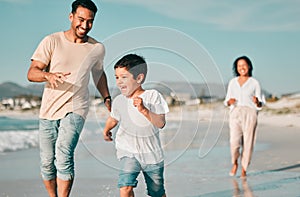 Family, father and son running on beach with mother, ocean and energy with bonding on holiday, happiness and freedom