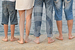 Family feet on beach