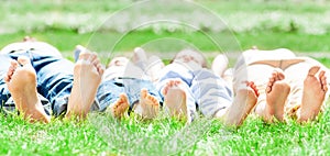 Family feet on grass